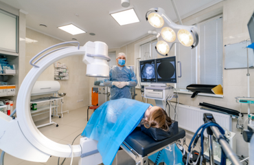 Radiographer Scanning Patient