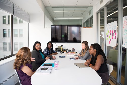 Group of business women having a discussion in Board Room