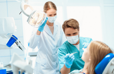 Dentist Working On Patient