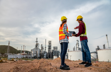 Man And Woman Working In Construction Site