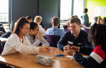 Group working at table doing a task together
