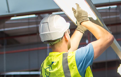 Construction Worker Changing Light