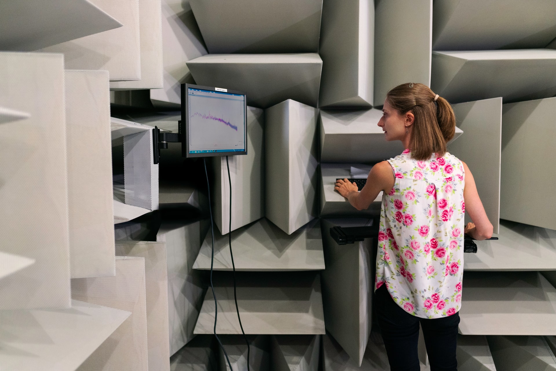 Sound Engineer in a specialist sound room on a computer 