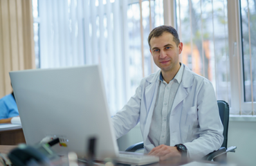 GP Sat At His Desk